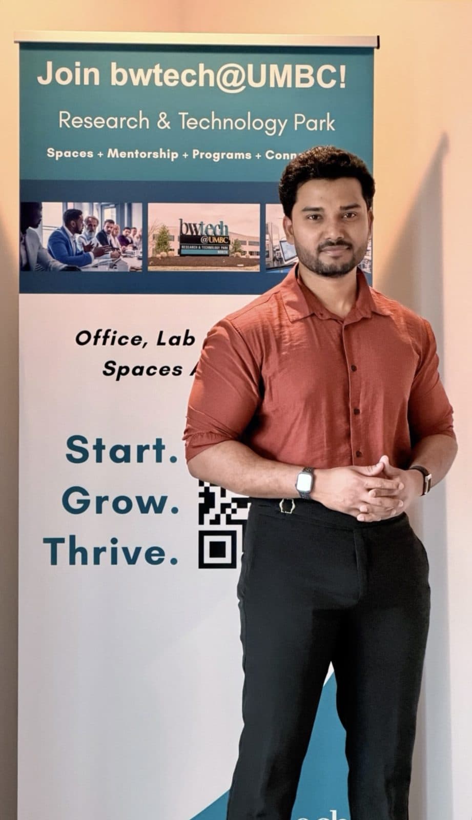 Manikanta in front of the bwtech@UMBC Research & Technology Park banner