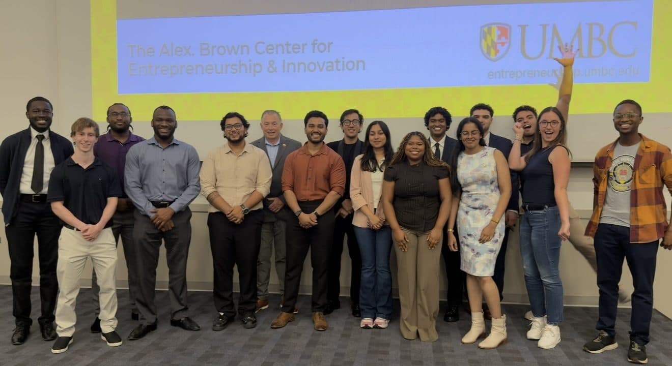 The UMBC Launchpad cohort in front of the Alex. Brown Center for Entrepreneurship & Innovation slide